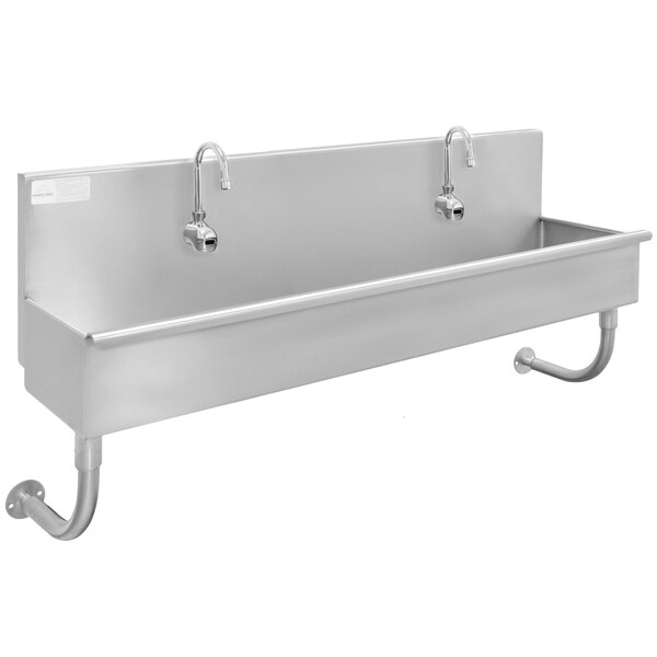 A stainless steel Advance Tabco multi-station hand sink with two faucets.