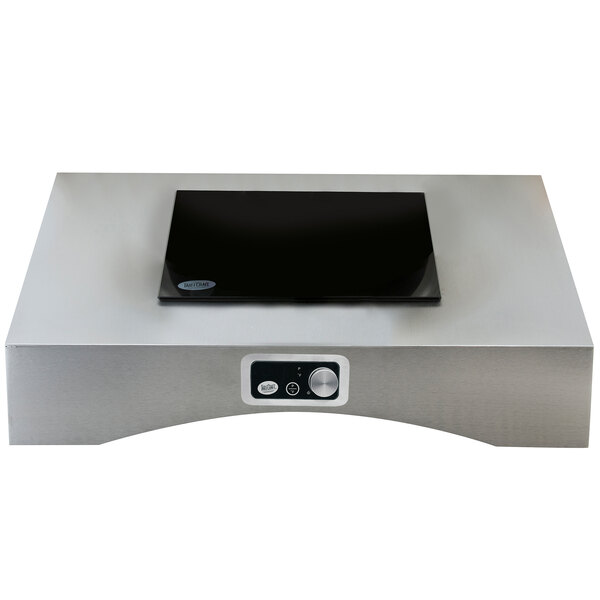 A rectangular silver Tablecraft countertop induction station with a black square object on top.