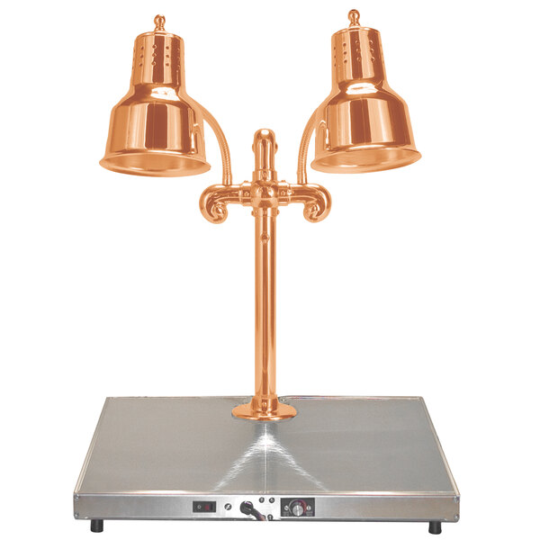 A Hanson bright copper carving station with two lamps on a metal surface.