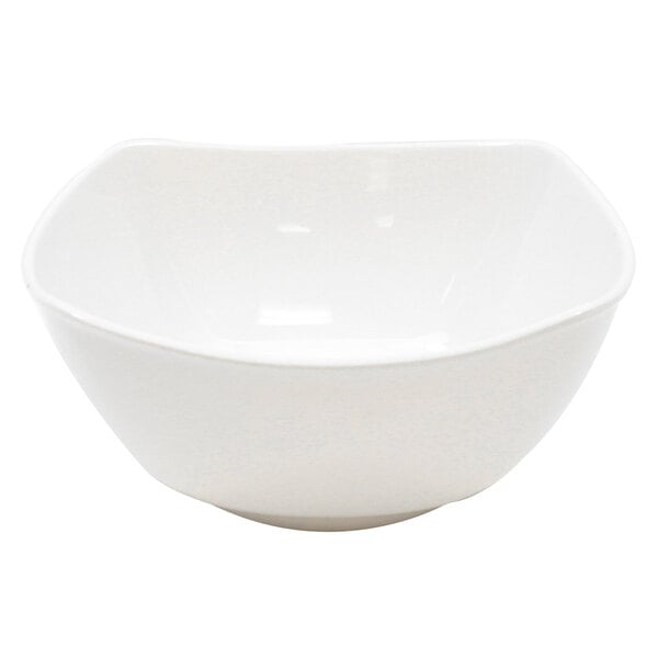 A Tablecraft white melamine bowl with a curved edge.