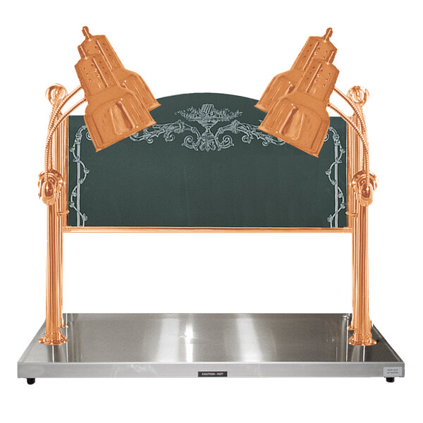 A Hanson Heat Lamps bright copper carving station with two gold lamps over a metal tray.