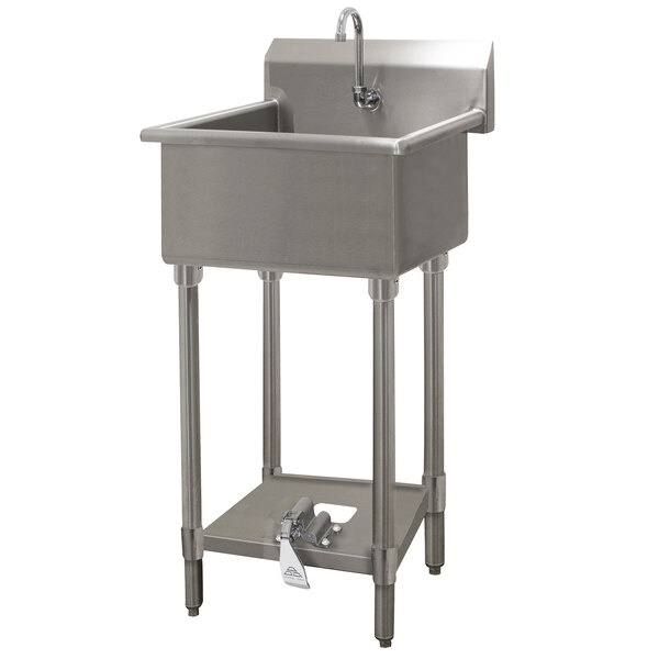 A large stainless steel Advance Tabco hand sink with a faucet and shelf.