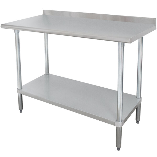 A stainless steel metal work table with a shelf.