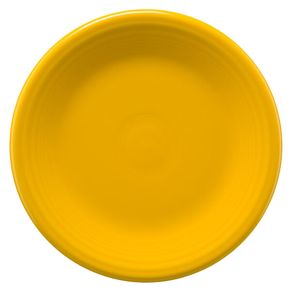 A yellow Fiesta® china salad plate with a black border on a white background.