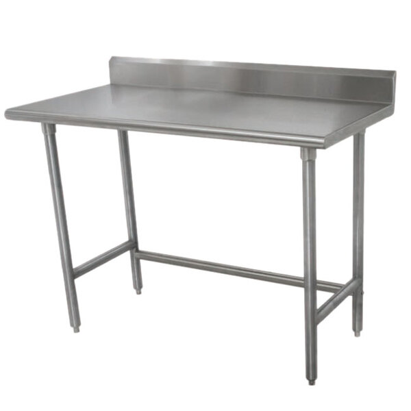 An Advance Tabco stainless steel work table with a 5" backsplash and galvanized legs.