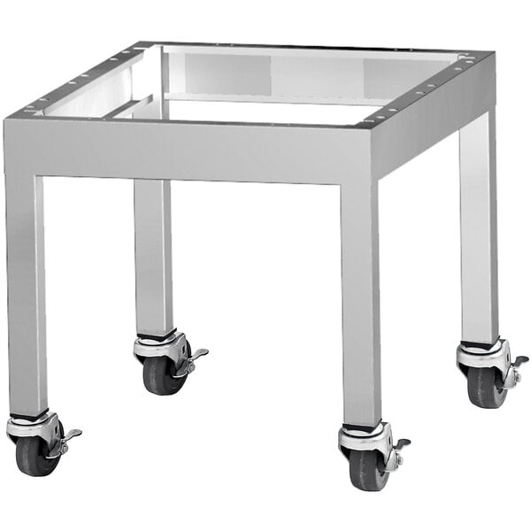 A stainless steel table with wheels for a Garland G Series charbroiler.
