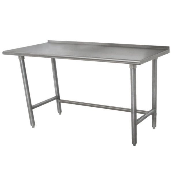 An Advance Tabco stainless steel work table with galvanized legs and a backsplash.