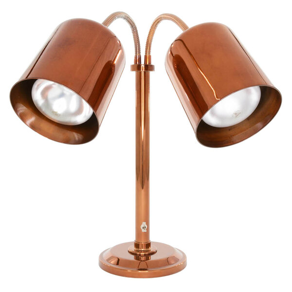 A Hanson Heat Lamp with two copper lamps on a stand.