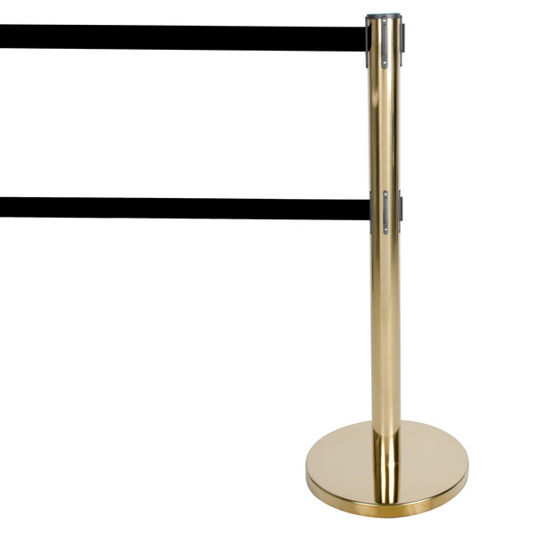 A gold Aarco crowd control stanchion with black tape on the pole.