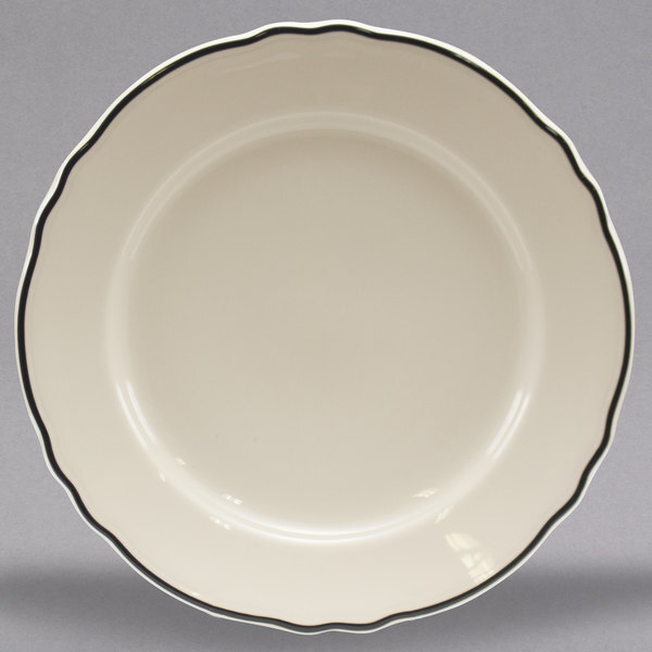 A white Homer Laughlin china plate with black trim.