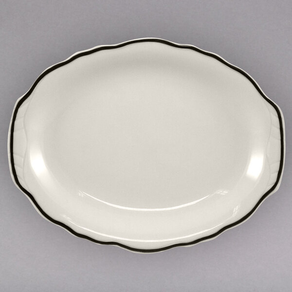 A white Homer Laughlin china platter with black trim.