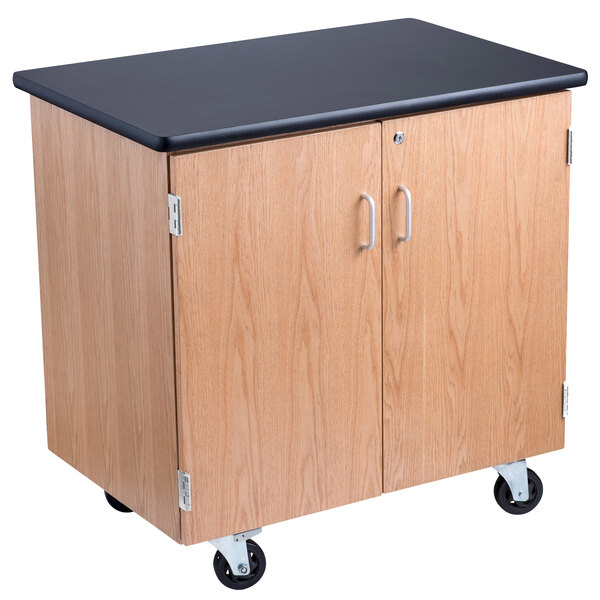 A black National Public Seating mobile science storage cabinet with wheels.