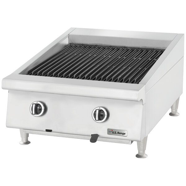 A U.S. Range liquid propane charbroiler with adjustable grates and ceramic briquettes on a counter.