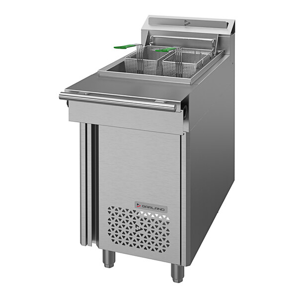 A large commercial U. S. Range natural gas floor fryer with a green handle.