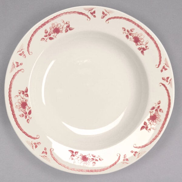 A Homer Laughlin ivory china pasta bowl with red roses painted on it.