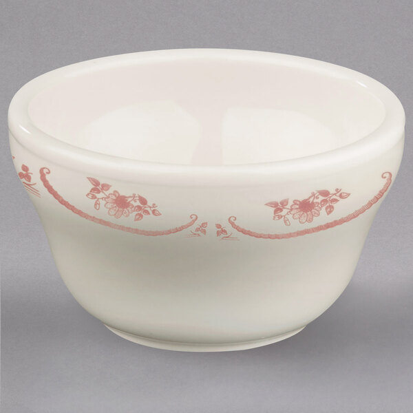An ivory china bouillon bowl with a pink rose design.
