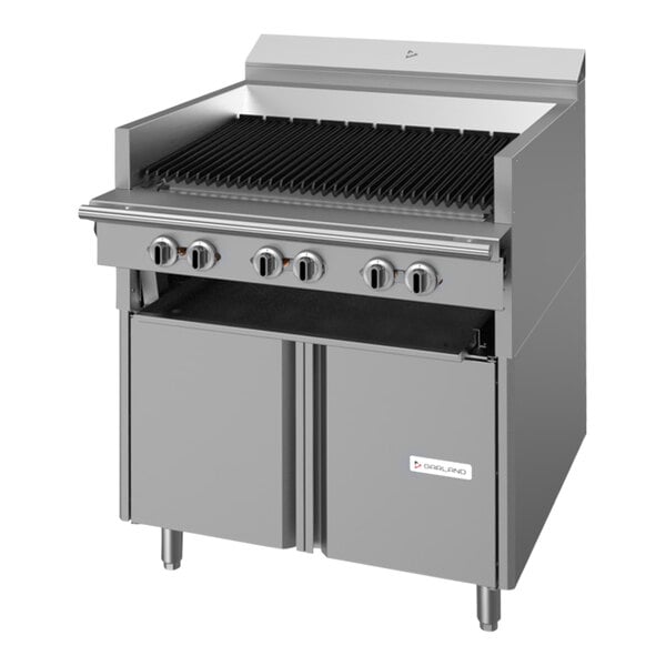 A stainless steel Garland natural gas charbroiler with a storage base and black knobs.