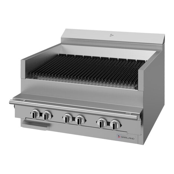 A stainless steel Garland range match charbroiler with black grills.