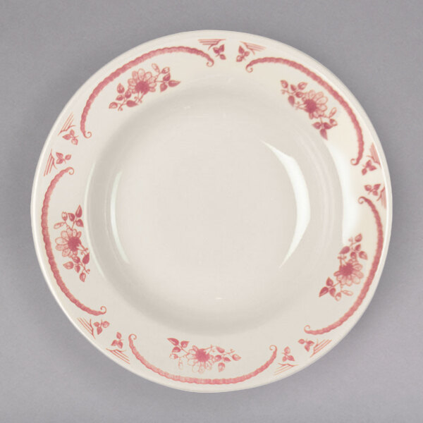 A white Homer Laughlin china rim soup bowl with a red rose design.