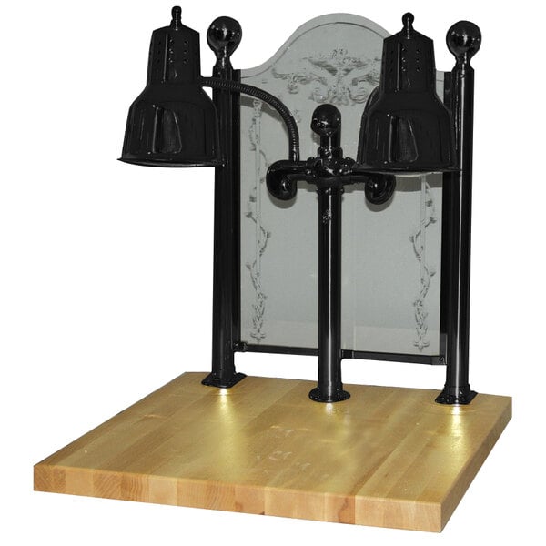 A Hanson Heat Lamps black carving station with maple base on a wooden surface.