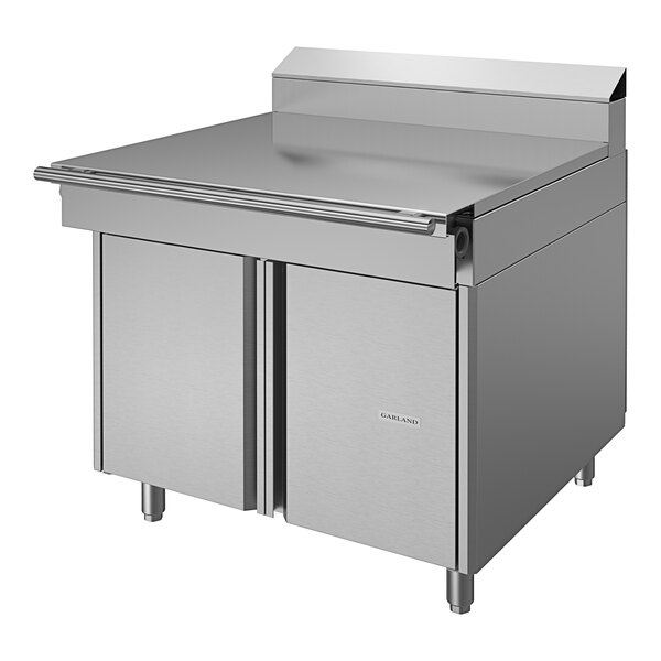 A stainless steel U.S. Range Cuisine Series spreader cabinet on a commercial kitchen counter.