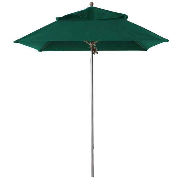 A forest green Grosfillex Windmaster umbrella on an aluminum pole.