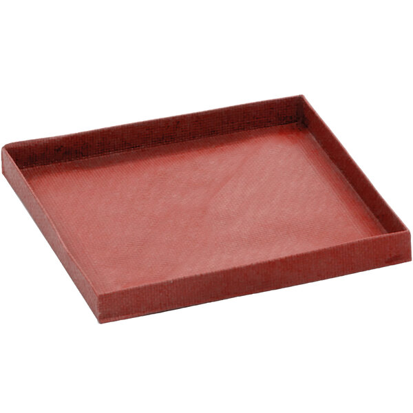 A red rectangular Merrychef solid non-stick basket with a handle.