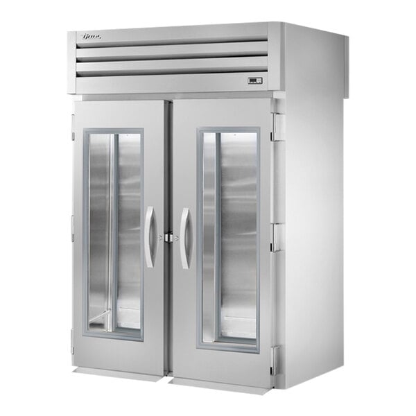 A silver True Spec Series roll-through refrigerator with glass doors.