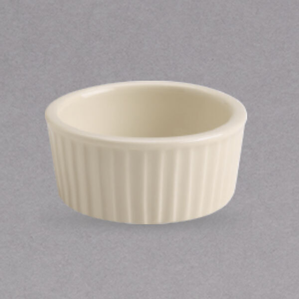 A Homer Laughlin ivory fluted ramekin with a ribbed rim.