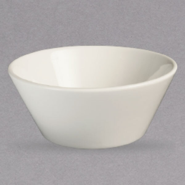 A Homer Laughlin ivory china bowl on a grey surface.