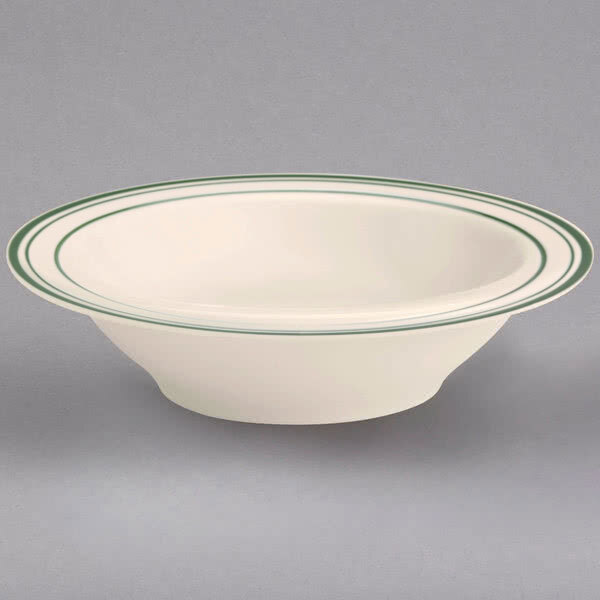 A white bowl with green lines on the rim.