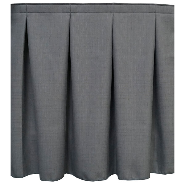 A grey pleated table skirt with velcro clips.
