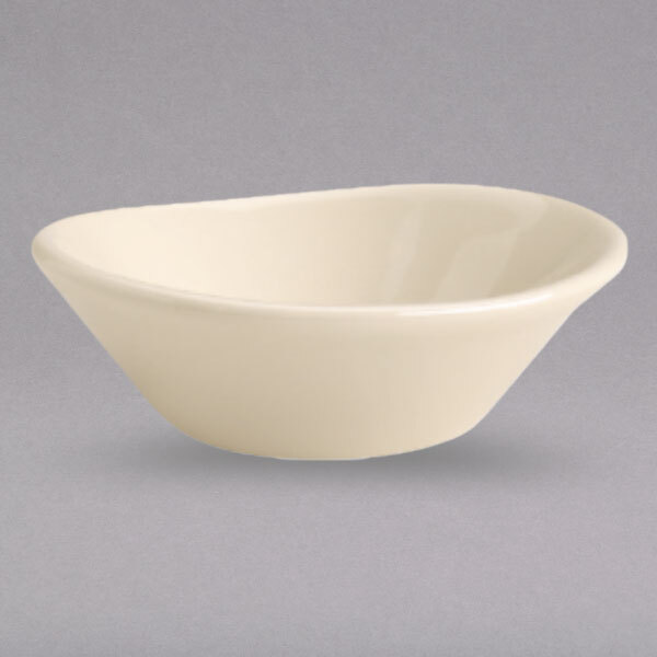 An ivory china bowl with a white rim.