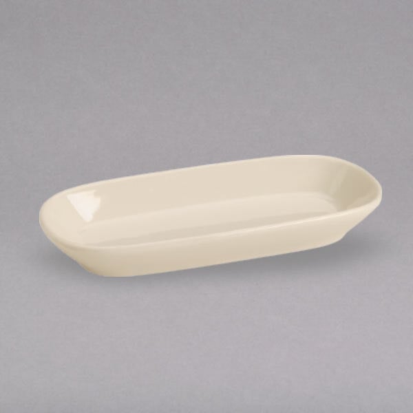 A white rectangular celery plate with a small oval shape.