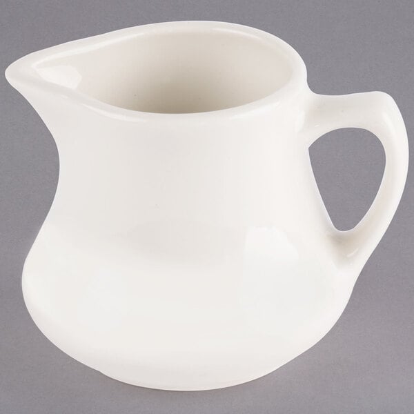 A Homer Laughlin ivory china jug creamer with a handle.