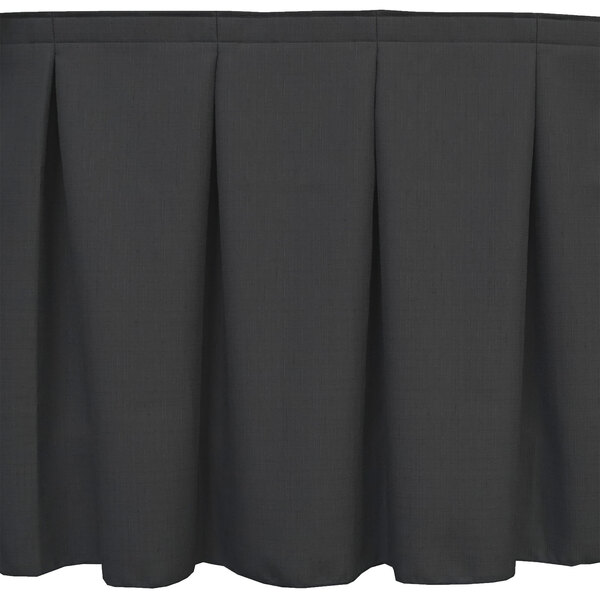 A black table skirt with a pleated pattern.