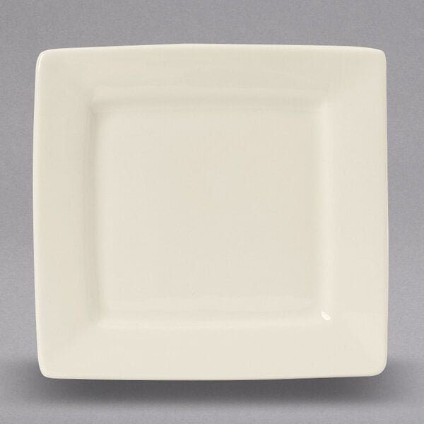 A Tuxton square white china plate with a small rim.