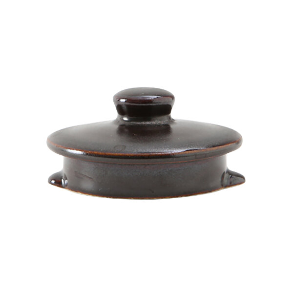 A black ceramic lid with a small knob on top for a Tuxton Royal Tea Pot.