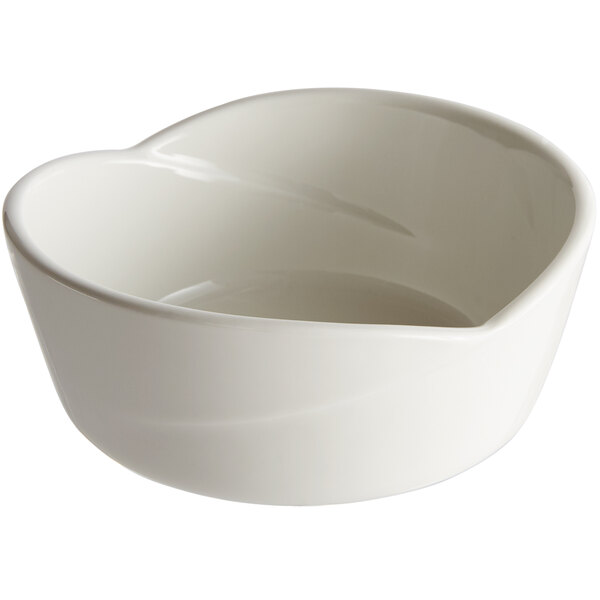 A Tuxton AlumaTux pearl white china bowl with a heart shape on it.