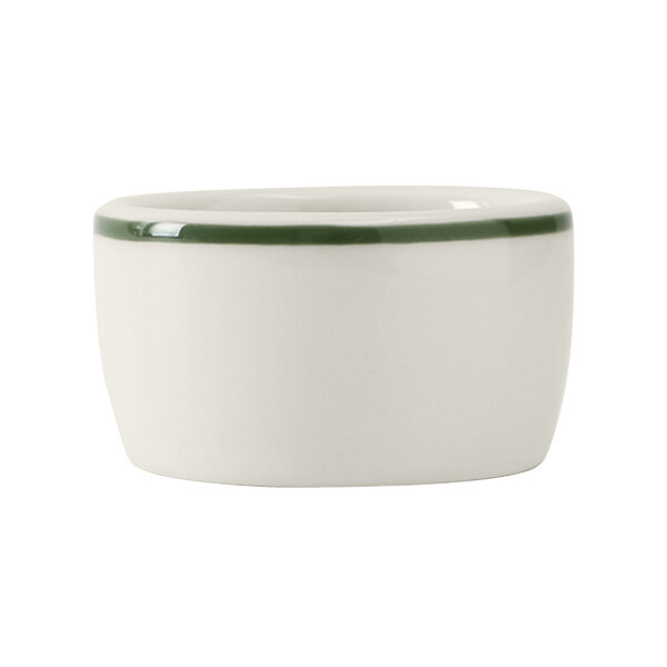 A white bowl with a green rim.