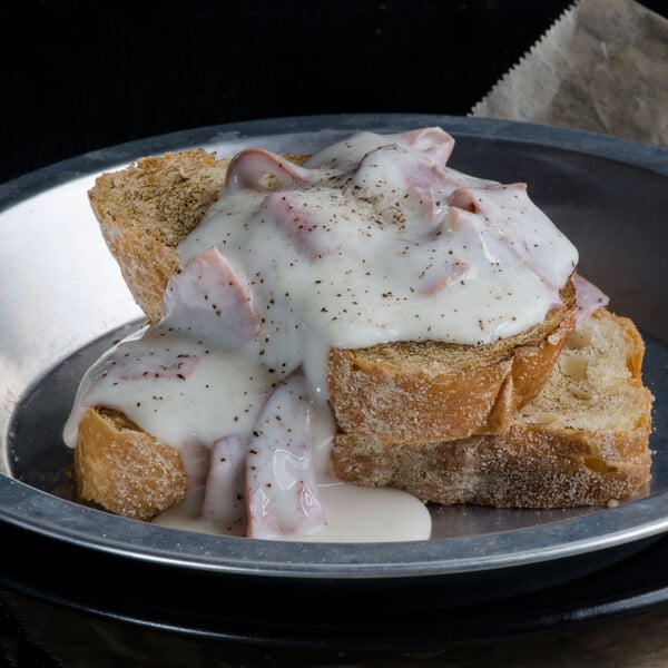 A plate of food with Spring Glen Fresh Foods cream chipped beef in white sauce.