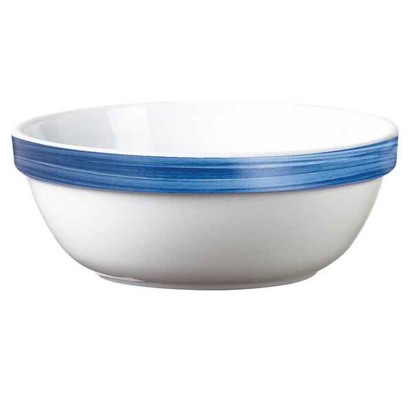 An Arcoroc white opal bowl with a blue rim.