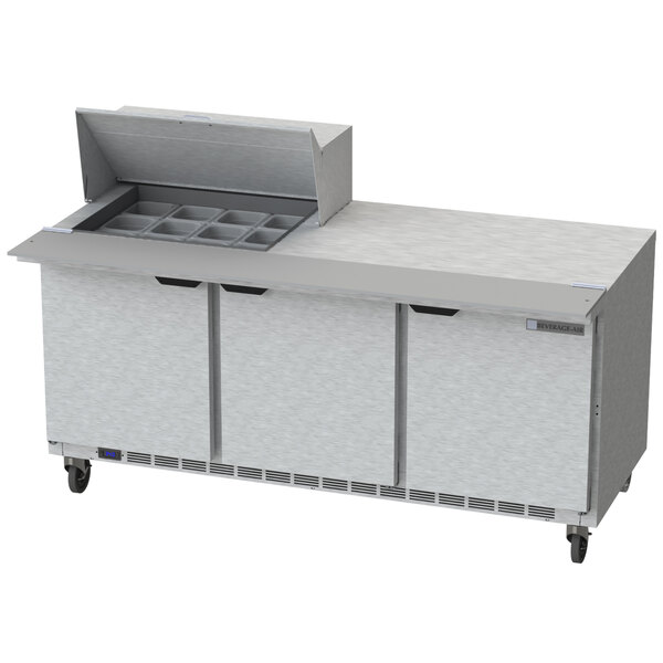 A Beverage-Air stainless steel refrigerated sandwich prep table with three doors.