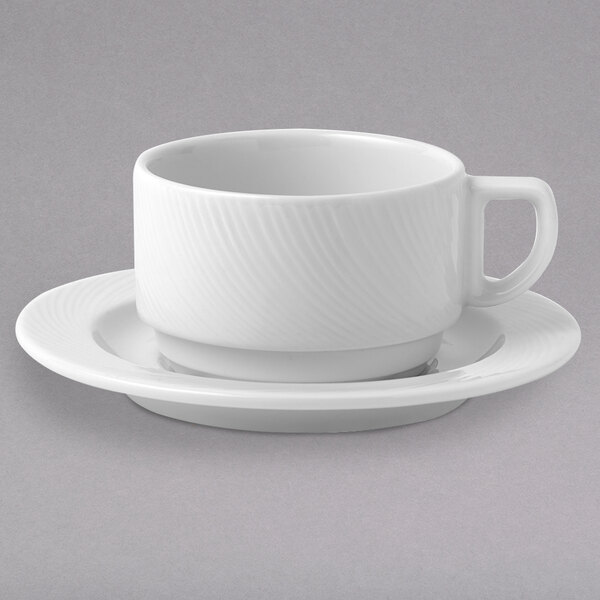 An Arcoroc white porcelain cup and saucer on a white surface.