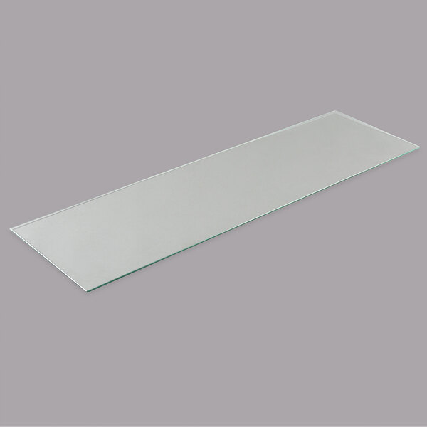 A rectangular glass shelf with a white border.