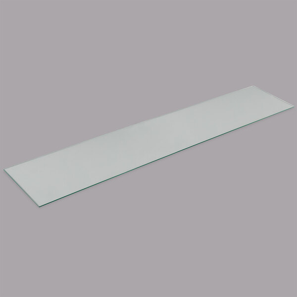 A rectangular white object with a glass surface.