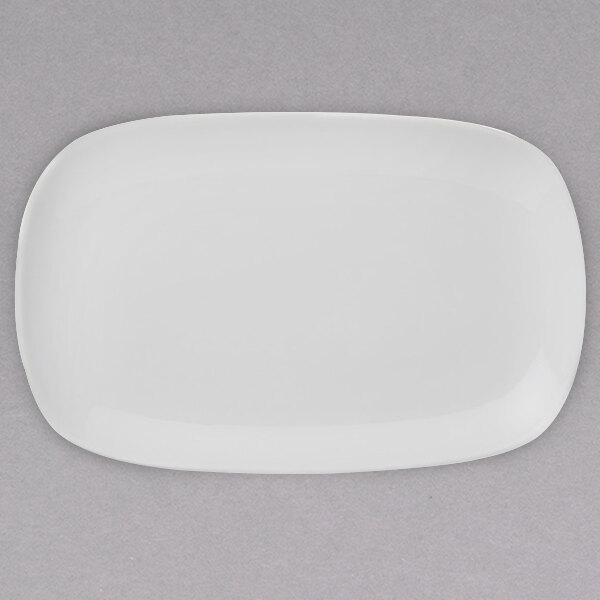 A white rectangular porcelain plate with a small rim.