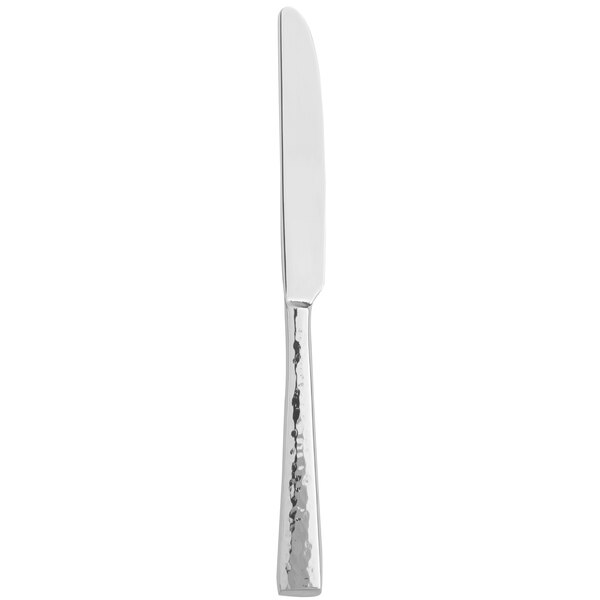 An 1880 Hospitality stainless steel dessert knife with a white handle.