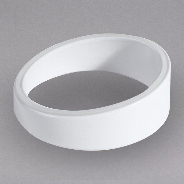 A white circular melamine riser with a hole in the middle.