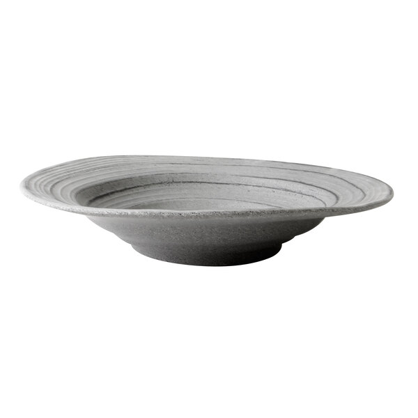 An Elite Global Solutions Della Terra melamine serving bowl with a granite stone design and gray rim.